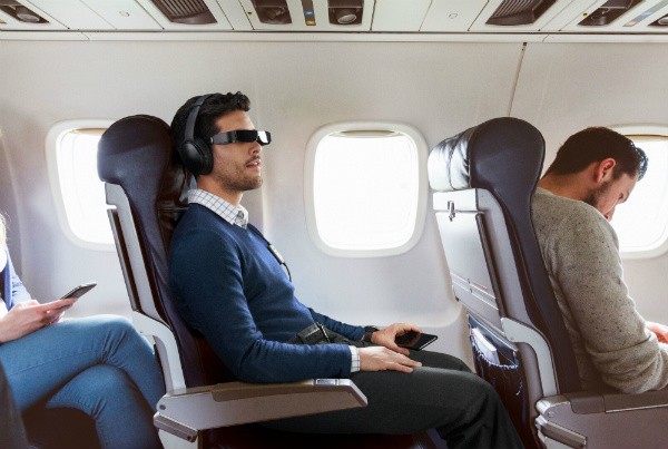 Epson Moverio AR glasses used by a traveler on an airplane for privacy